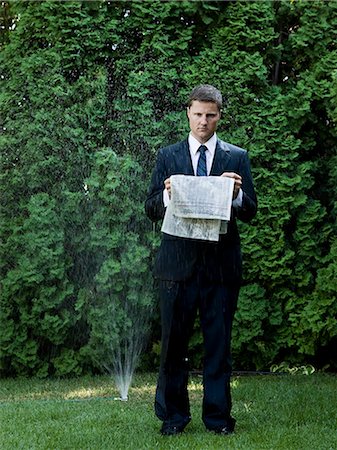 simsearch:640-08089629,k - man in a suit standing next to a sprinkler Stock Photo - Premium Royalty-Free, Code: 640-08089439