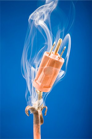 electrical plugs danger - burnt extension cord Stock Photo - Premium Royalty-Free, Code: 640-08089530