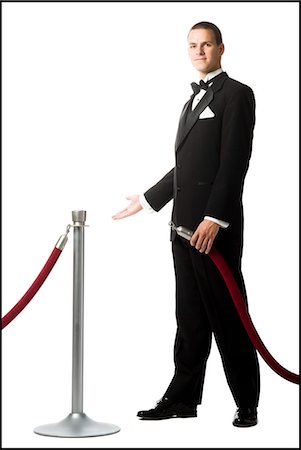 man in a tuxedo next to a velvet rope Foto de stock - Royalty Free Premium, Número: 640-08089594