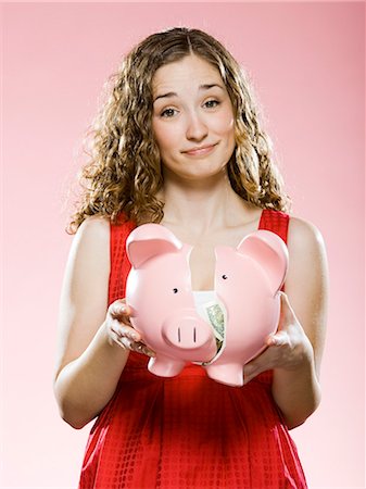 simsearch:614-03903103,k - woman holding a broken piggy bank Foto de stock - Sin royalties Premium, Código: 640-08089738