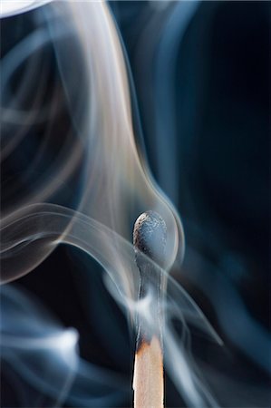 Studio shot of burnt match giving off smoke Stock Photo - Premium Royalty-Free, Code: 640-08089750