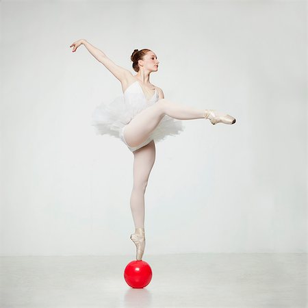 Studio shot of ballet dancer balancing on ball Stock Photo - Premium Royalty-Free, Code: 640-08546035