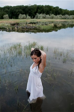 USA, Utah, Provo, woman wading in lake Stock Photo - Premium Royalty-Free, Code: 640-08546074