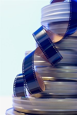 film reels - Coiled film strip and canister Stock Photo - Premium Royalty-Free, Code: 640-01348362