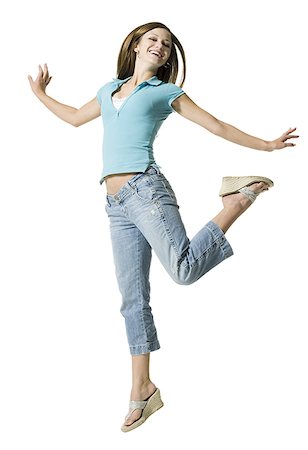 A young woman jumping Stock Photo - Premium Royalty-Free, Code: 640-01348404