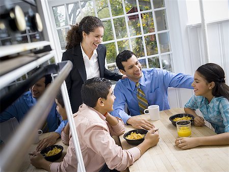 son (céréale) - High angle view of a family at a breakfast table Stock Photo - Premium Royalty-Free, Code: 640-01348516