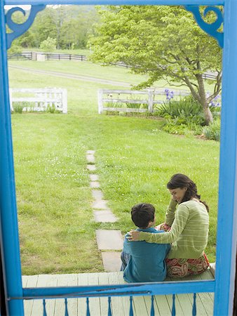 family with ten children - Rear view of a woman looking at her son Stock Photo - Premium Royalty-Free, Code: 640-01348733