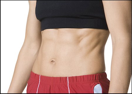 Close-up of a woman's abdominal muscles Stock Photo - Premium Royalty-Free, Code: 640-01348741
