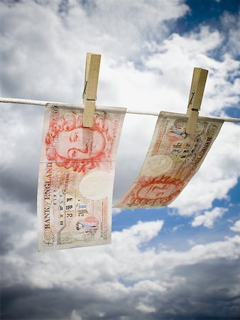 simsearch:640-01349807,k - Low angle view of English paper currency pegged on a clothesline Foto de stock - Sin royalties Premium, Código: 640-01348813