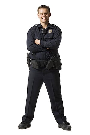 simsearch:640-03262582,k - Male police officer standing with arms crossed smiling Stock Photo - Premium Royalty-Free, Code: 640-01348916