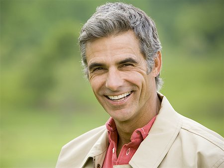 Portrait of a man smiling Stock Photo - Premium Royalty-Free, Code: 640-01349073