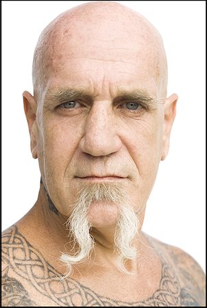 face man tatoo - Bald man with tattoos Stock Photo - Premium Royalty-Free, Code: 640-01349116