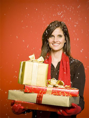 red scarf woman - Woman with Christmas gifts in snow Stock Photo - Premium Royalty-Free, Code: 640-01349118