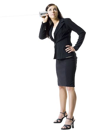 Profile of a teenage girl holding a tin can phone and listening Foto de stock - Sin royalties Premium, Código: 640-01349136