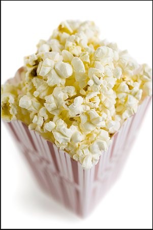 popcorn white background - Detailed view of popcorn in box Stock Photo - Premium Royalty-Free, Code: 640-01349142