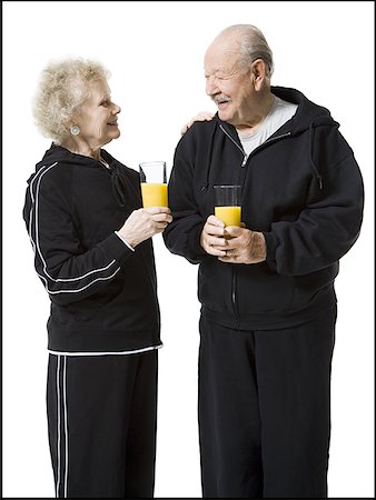 simsearch:640-01358490,k - Older couple in track suits taking a juice break Stock Photo - Premium Royalty-Free, Code: 640-01349208