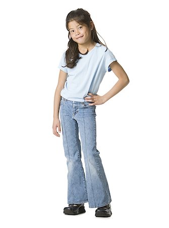 Portrait of a girl standing with her hand on hip Stock Photo - Premium Royalty-Free, Code: 640-01349261