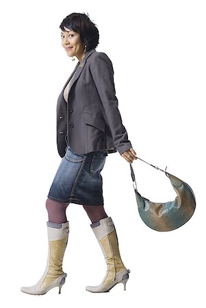 simsearch:640-02770635,k - Woman with knee high boots and handbag Stock Photo - Premium Royalty-Free, Code: 640-01349302