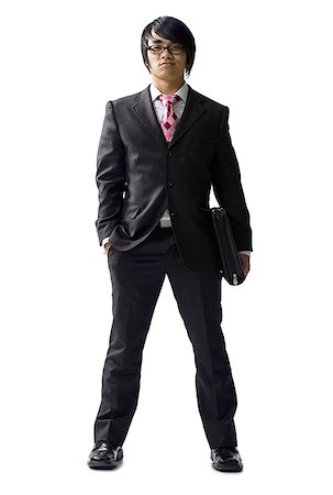 etiquette men - Portrait of a businessman with his hand in his pocket Stock Photo - Premium Royalty-Free, Code: 640-01349323