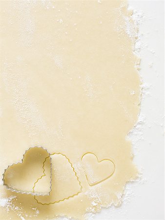 simsearch:640-02772561,k - Detailed view of dough with heart cookie cutter Stock Photo - Premium Royalty-Free, Code: 640-01349358