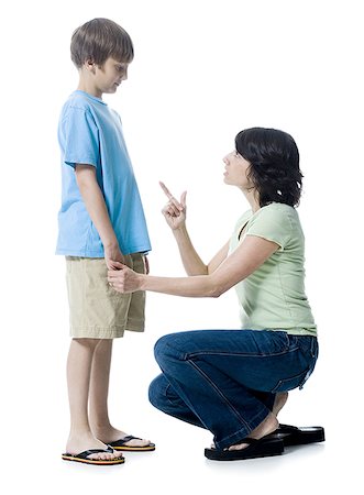 Close-up of a mid adult woman scolding her son Stock Photo - Premium Royalty-Free, Code: 640-01349405