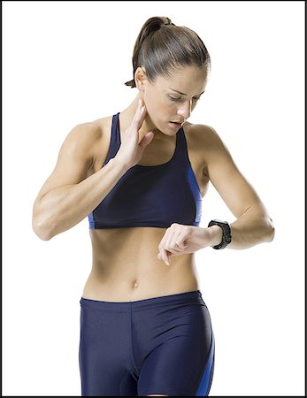 Close-up of a woman looking at her wristwatch Foto de stock - Sin royalties Premium, Código: 640-01349496