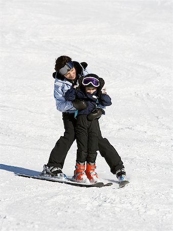 ski goggles mature not senior - Woman and young girl skiing Stock Photo - Premium Royalty-Free, Code: 640-01349676
