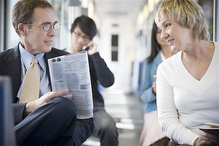 european mature women tubes - Businessman and a businesswoman talking on a commuter train Stock Photo - Premium Royalty-Free, Code: 640-01349681