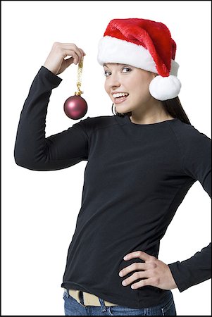 simsearch:640-01366289,k - Portrait of a young woman holding a Christmas ornament Fotografie stock - Premium Royalty-Free, Codice: 640-01349735