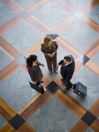 Three business colleagues in informal meeting Stock Photo - Premium Royalty-Free, Code: 640-01349787