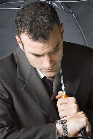 simsearch:640-02656983,k - Close-up of a businessman looking at his wristwatch Foto de stock - Sin royalties Premium, Código: 640-01349841