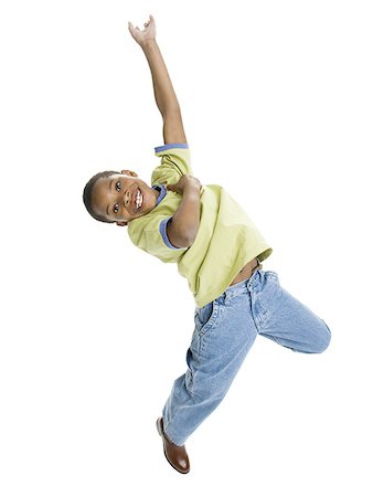 simsearch:640-01362252,k - Portrait of a boy jumping Foto de stock - Royalty Free Premium, Número: 640-01349907