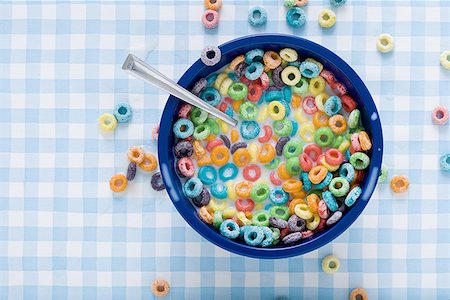 Bowl of cereal with milk and cereal on tablecloth Stock Photo - Premium Royalty-Free, Code: 640-01349902