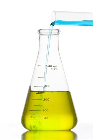 Liquid being poured into a conical flask with a test tube Stock Photo - Premium Royalty-Free, Code: 640-01349916