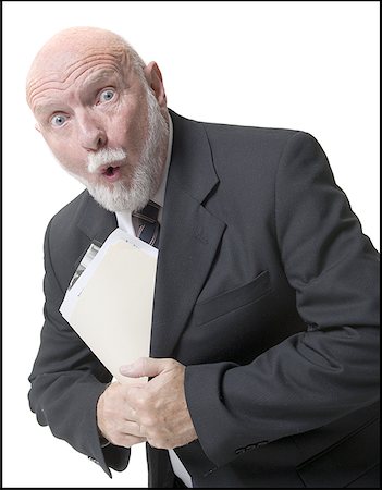 simsearch:640-01355000,k - Portrait of a businessman putting papers inside his coat Stock Photo - Premium Royalty-Free, Code: 640-01349928