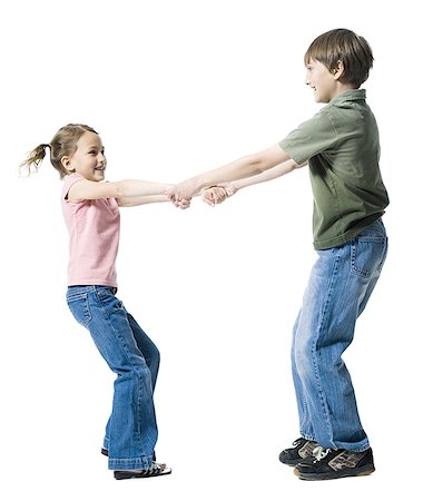 Close-up of a boy playing with his sister Stock Photo - Premium Royalty-Free, Code: 640-01354009