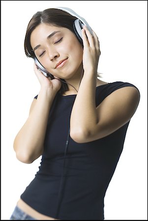 simsearch:640-01358972,k - Nahaufnahme einer jungen Frau, die Musik über Kopfhörer hören Stockbilder - Premium RF Lizenzfrei, Bildnummer: 640-01354141