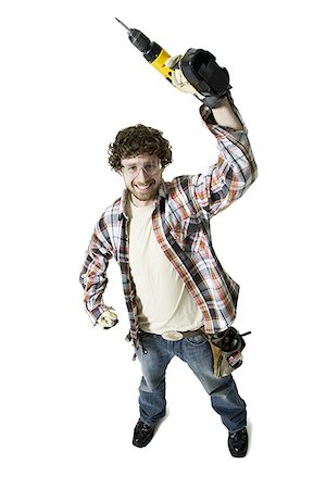 simsearch:640-01359391,k - High angle view of a carpenter holding up a drill Foto de stock - Royalty Free Premium, Número: 640-01354209