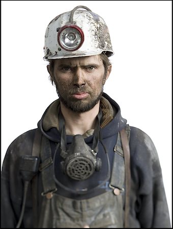 dirty overalls pictures - Portrait of a miner wearing a hardhat with a headlamp Stock Photo - Premium Royalty-Free, Code: 640-01354241