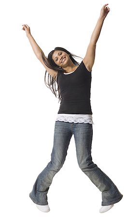 A teenage girl dancing with her arms raised Stock Photo - Premium Royalty-Free, Code: 640-01354252