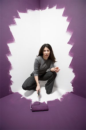 simsearch:640-03256374,k - Portrait of a mid adult woman painting herself into a corner Stock Photo - Premium Royalty-Free, Code: 640-01354290