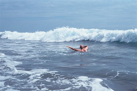 High angle view of a man swimming in the sea Stock Photo - Premium Royalty-Free, Code: 640-01354300