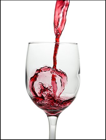 pour of liquor - Vin rouge versé dans le verre à vin Photographie de stock - Premium Libres de Droits, Code: 640-01354427