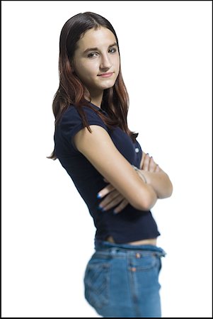 Portrait of a young woman standing with her arms crossed Stock Photo - Premium Royalty-Free, Code: 640-01354447