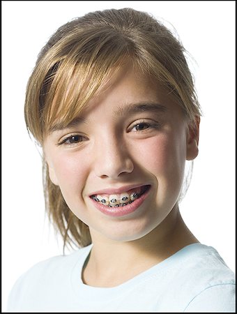 Smiling girl with braces Stock Photo - Premium Royalty-Free, Code: 640-01354454