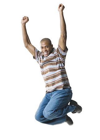 simsearch:640-01362252,k - Portrait of a young man jumping in mid-air Foto de stock - Royalty Free Premium, Número: 640-01354466