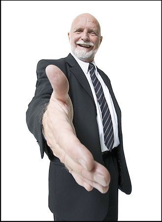 Portrait of a businessman holding out his hand Stock Photo - Premium Royalty-Free, Code: 640-01354537