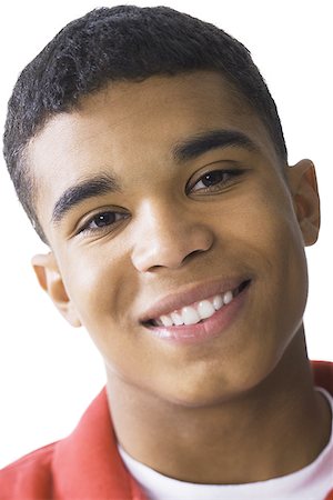 simsearch:640-02953105,k - Portrait of a young man smiling Fotografie stock - Premium Royalty-Free, Codice: 640-01354532