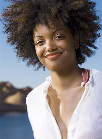 sketches of hairstyles for women - Portrait of a young woman grinning Stock Photo - Premium Royalty-Free, Code: 640-01354773