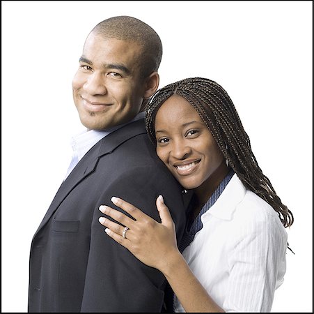 Portrait of a young man smiling with a young woman Stock Photo - Premium Royalty-Free, Code: 640-01354808